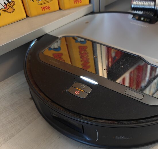 Roborock stuck beneath book-shelf baseboard